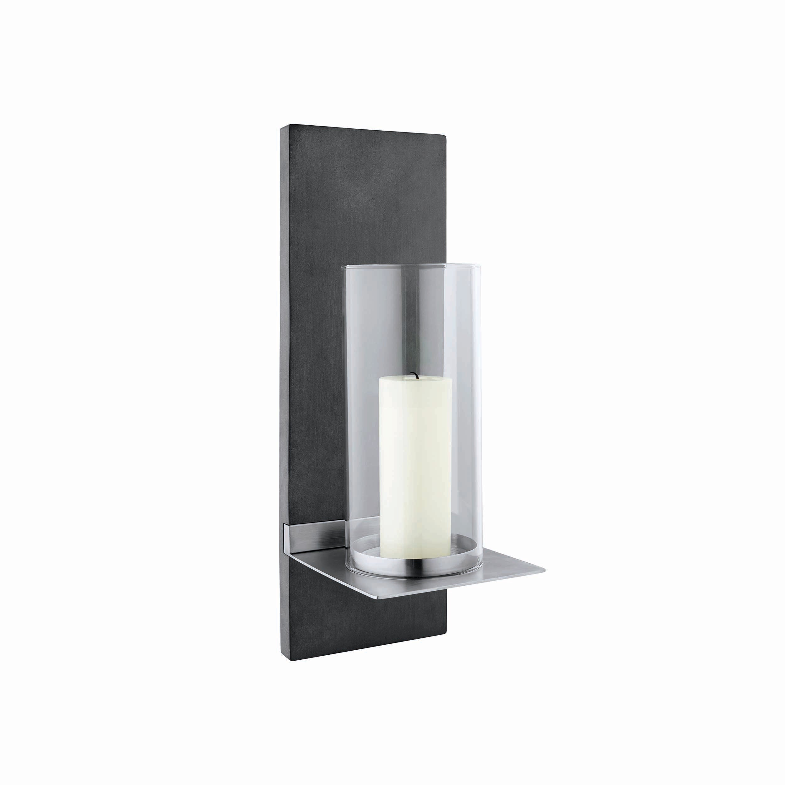 Cylindrical wall-mounted candle holder with a white candle inside on a white background