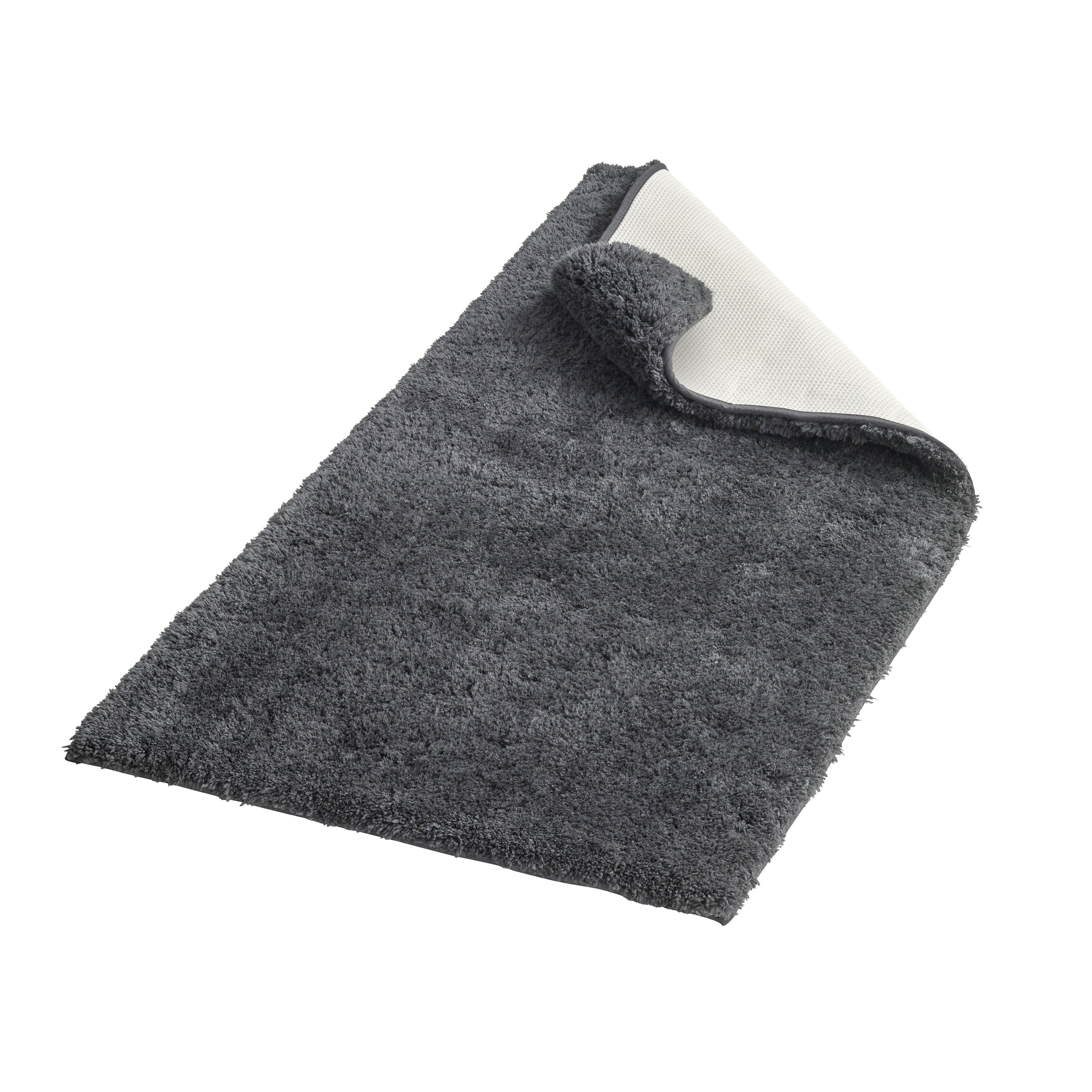 Bathmat flipped over on corner to show non-slip backing.