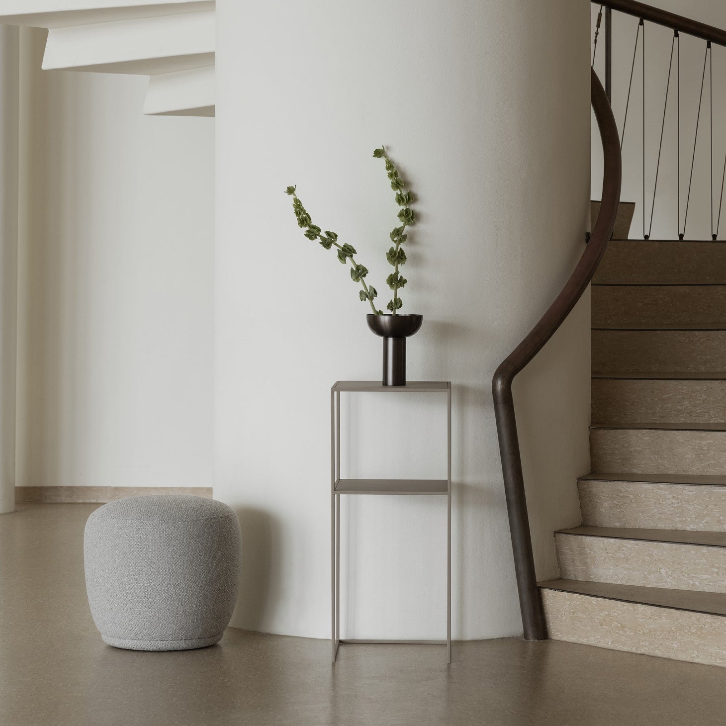 modern spiral staircase with FERA pedestal table by blomus