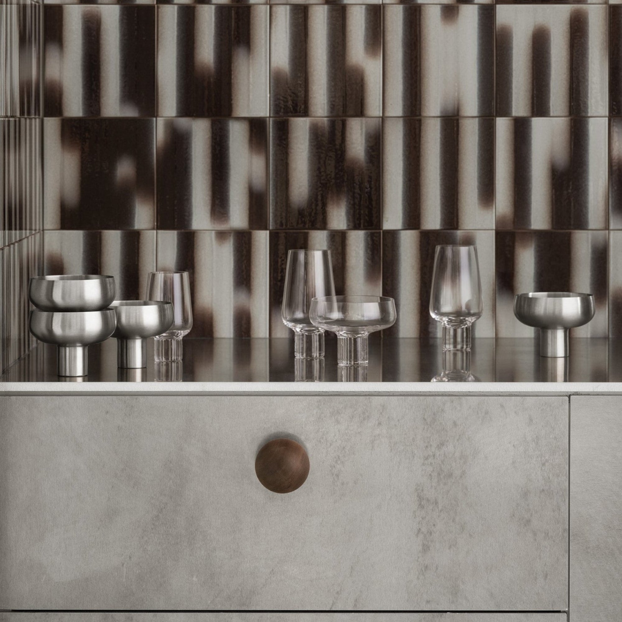 modern bar top adorned with stainless steel and handblown champagne coupes from blomus KOYOI collection