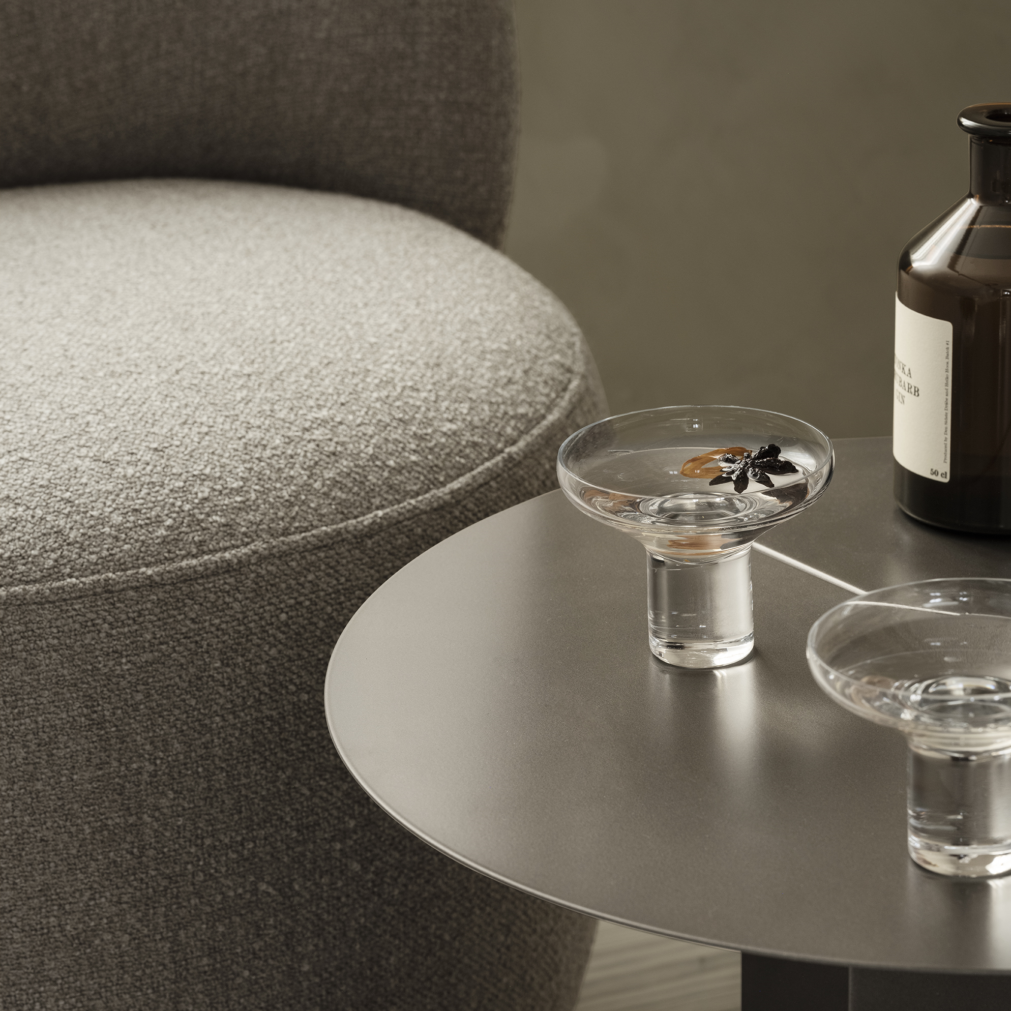 blomus KOYOI handblown champagne coupe on a modern stainless steel side table