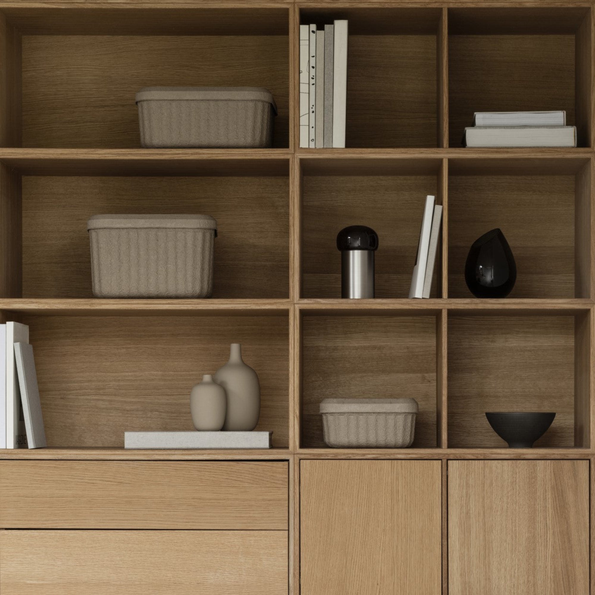 Modern wooden shelves with REDO recycled pulp storage baskets by blomus