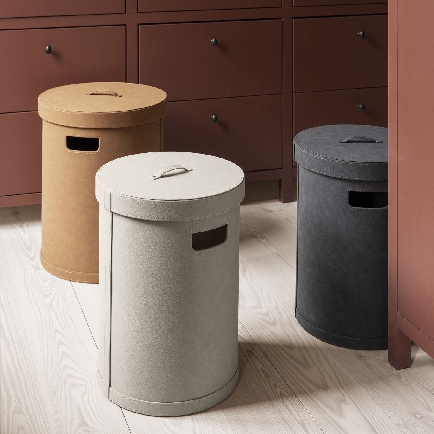 Faux suede storage bin with lid in a tidy bedroom setting