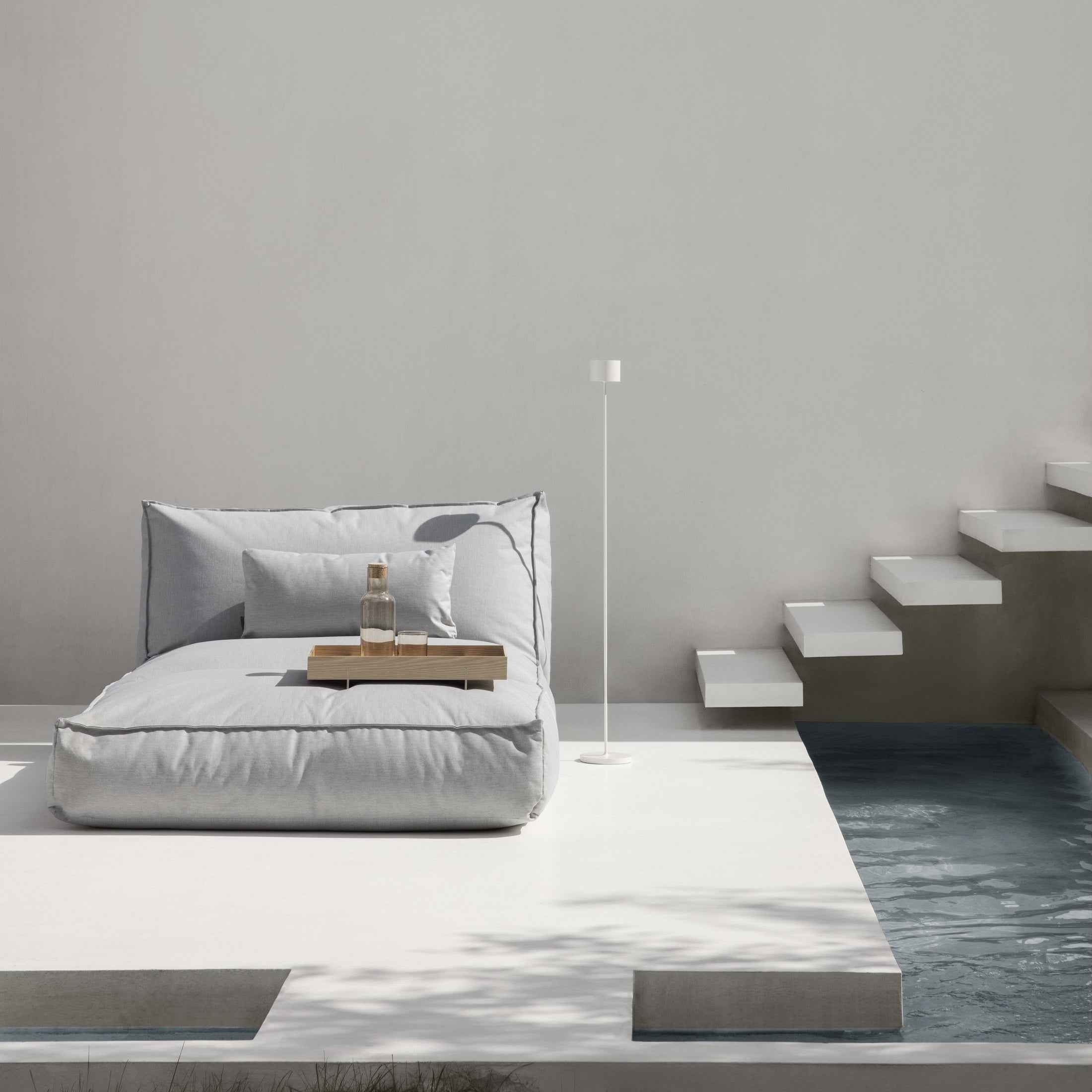 Modern poolside lounger with a Mediterranean patio flair 
