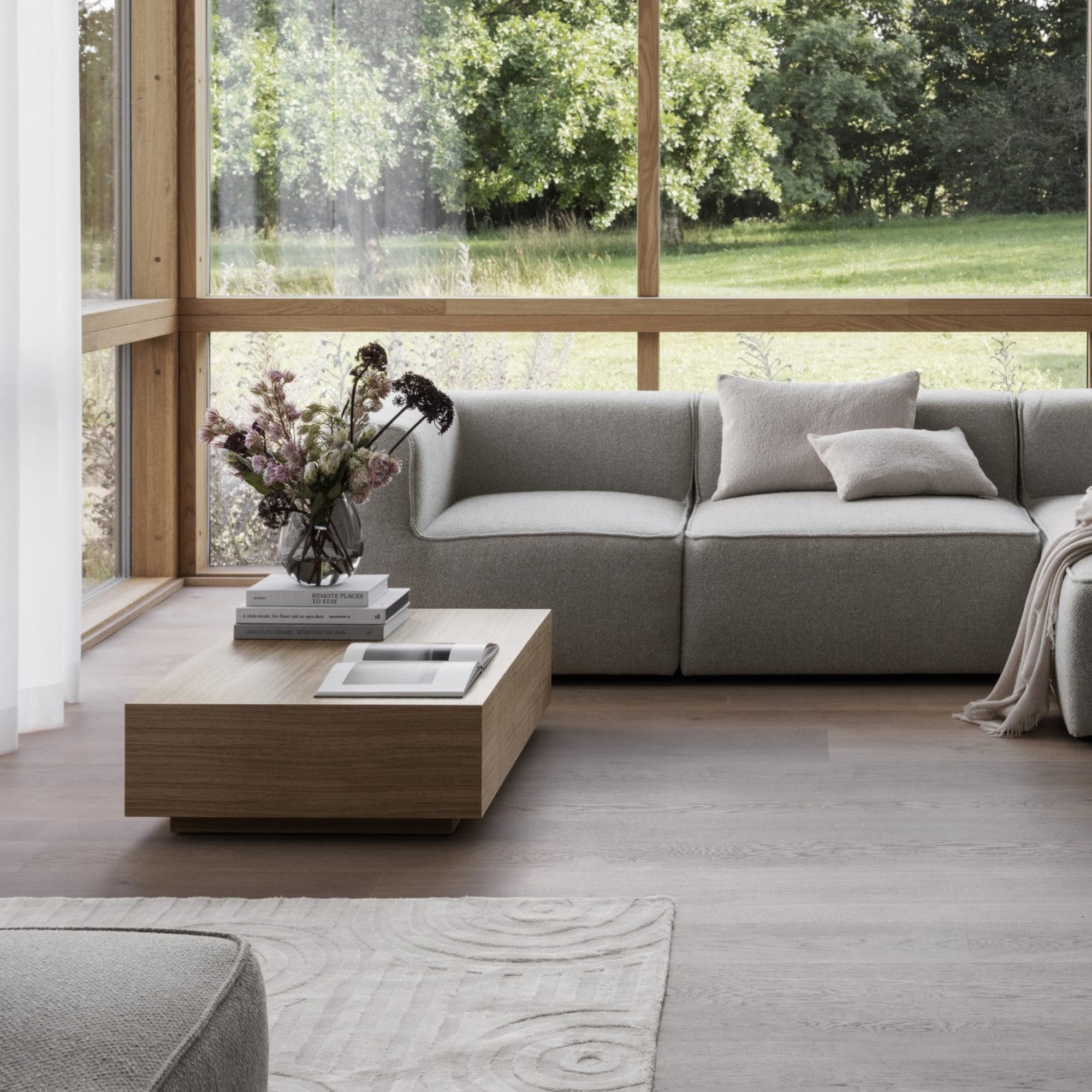 understated modern living area with viscose area rug by blomus