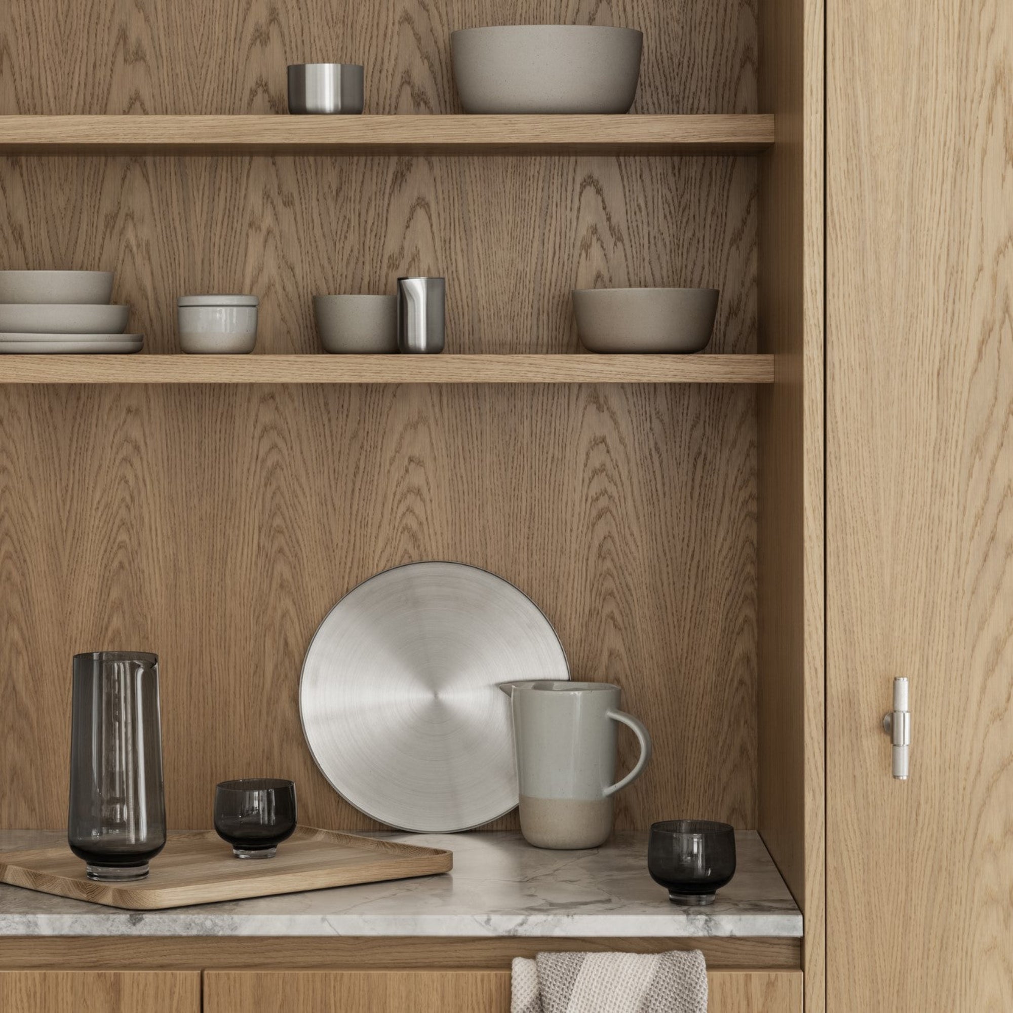 stylish wood shelves and marble countertop with stoneware dishes and an OKU oak serving tray 