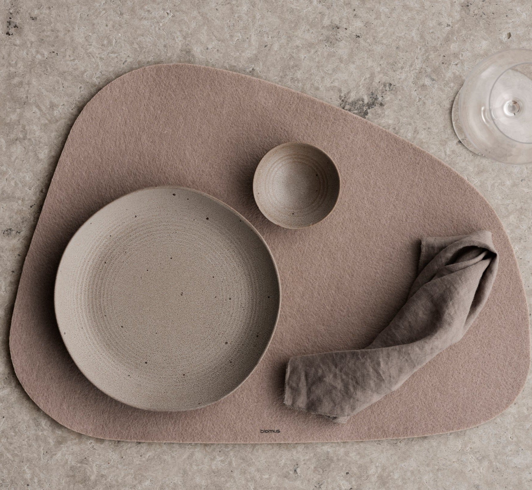 blomus LAGONA felt placemat displayed with a minimalist dinner setting 