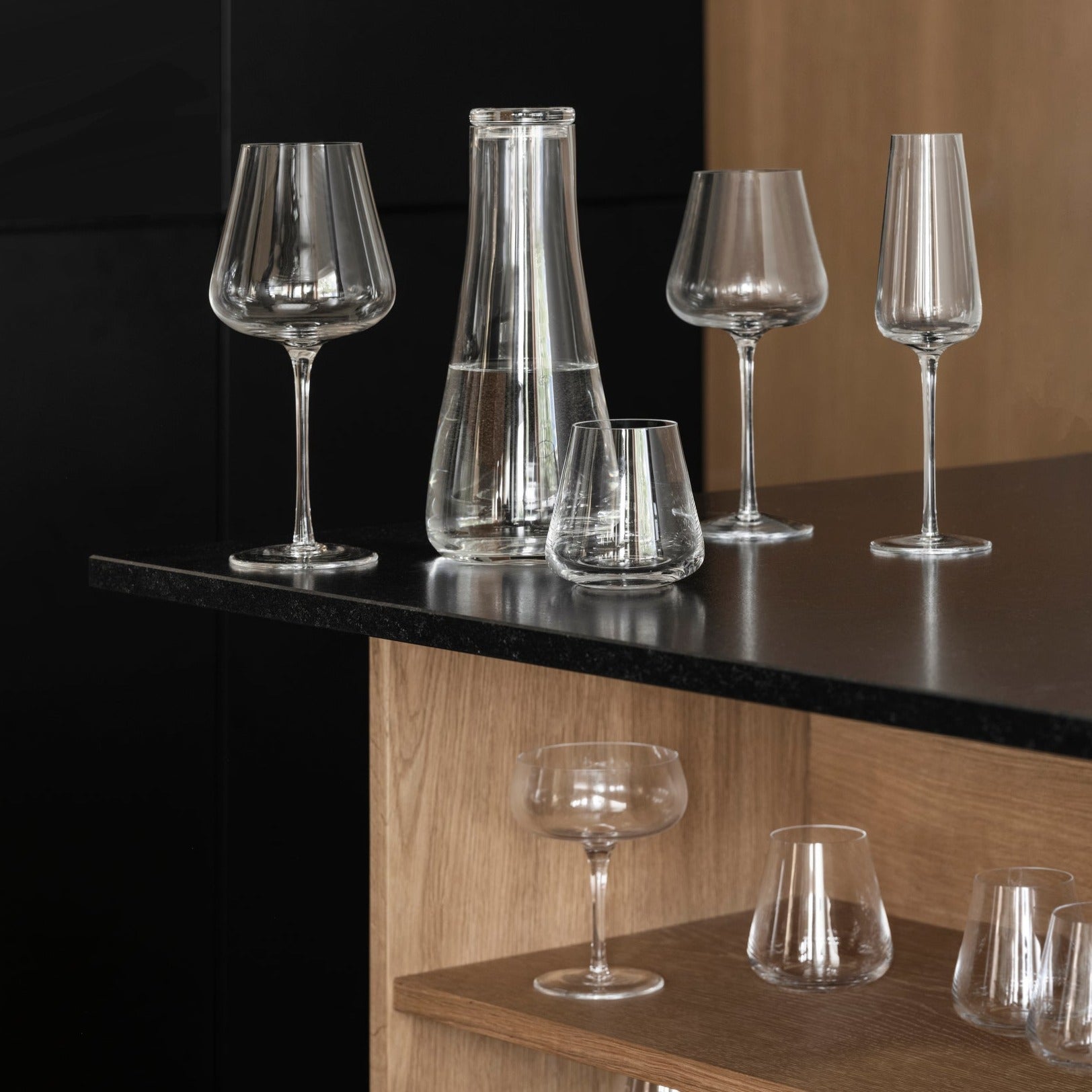 blomus BELO mouthblown wine glasses arranged on  a modern black countertop