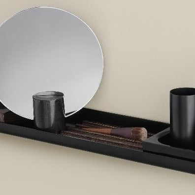 metal shelf with cosmetic items in a wood tray organizer on a wall shelf