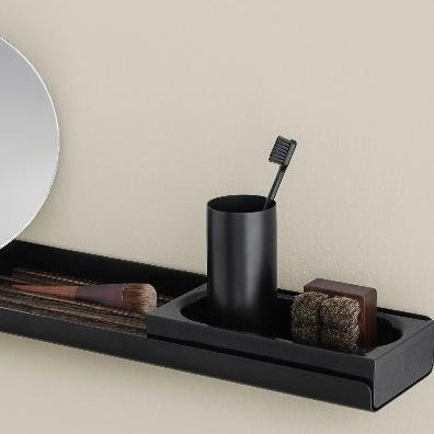 Metal wall shelf with acrylic tray holding toothbrush cup