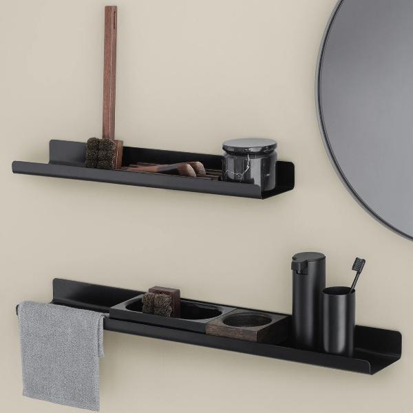 hygiene and cosmetic items arranged in acrylic trays on metal wall shelves