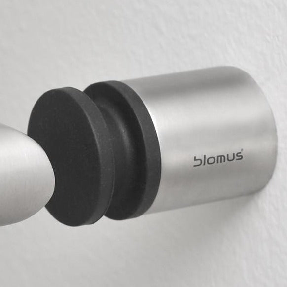 sleek simple stainless steel door handle stop by blomus