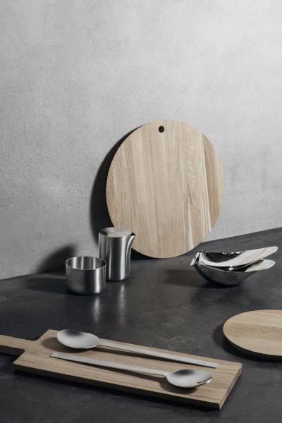 blomus BORDA Oak Cutting Board by Blomus next to kitchen wares on a black countertop