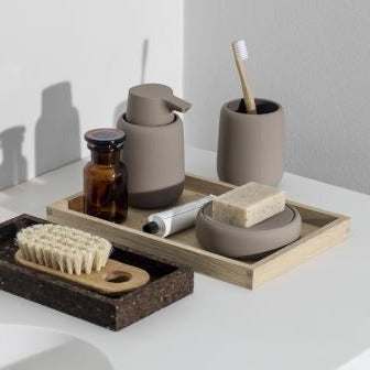 Modern minimalist bathroom accessories with matte finish in a sleek bathroom setting