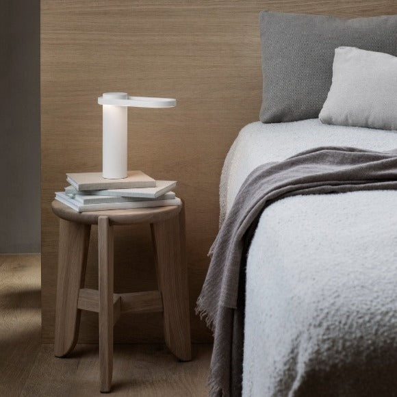 ELI oak Stool supporting a bedside lamp 