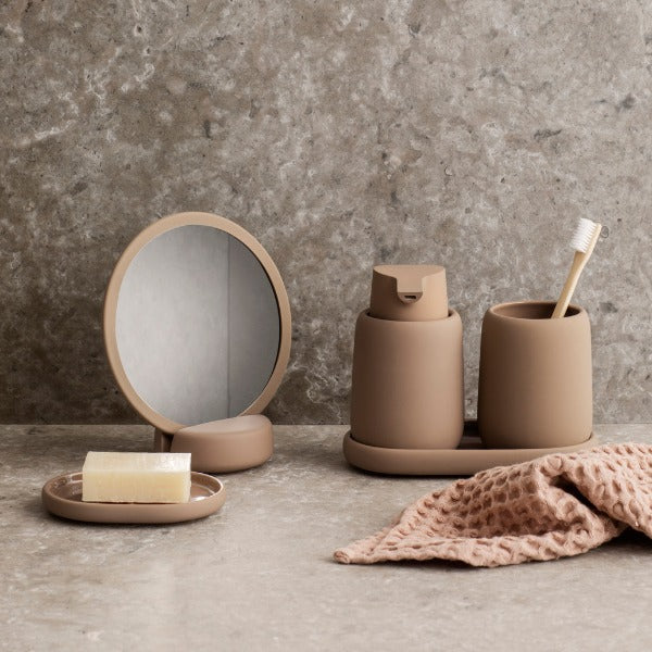 soft touch ceramic soap dish and dispenser from blomus on a marble countertop