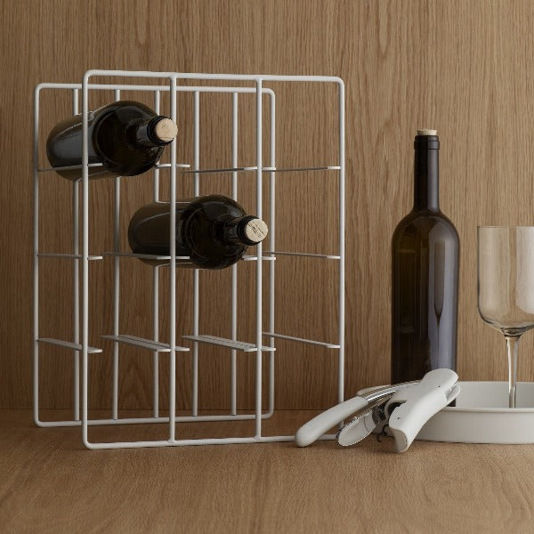 blomus LEVERMAN corkscrew with wine rack on a modern wooden countertop 