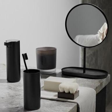 elegant modern black bathroom accessories on a marble countertop