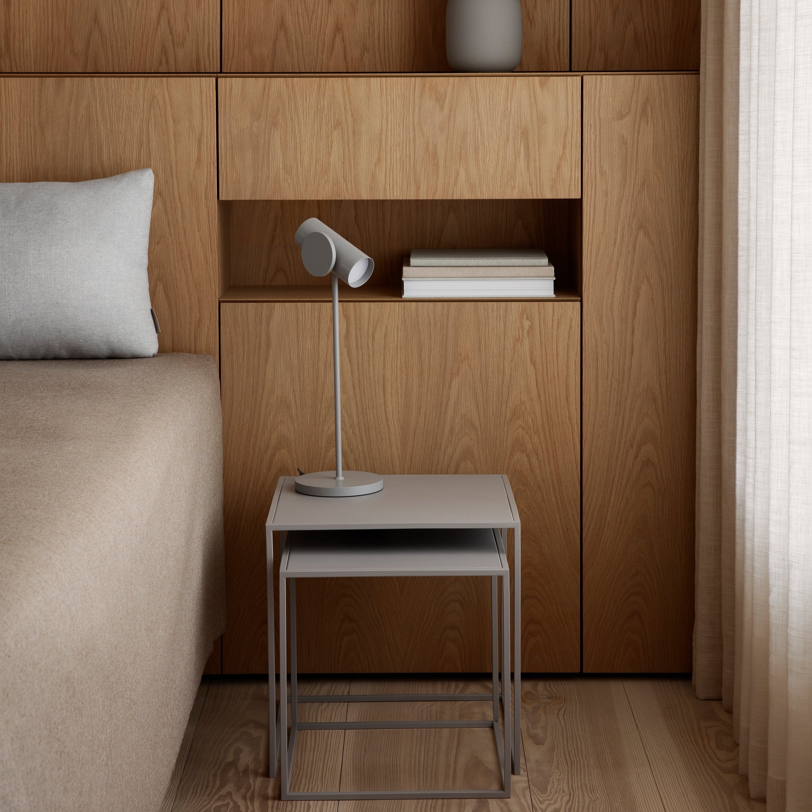 powder coated nesting tables in minimalist contemporary bedroom