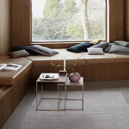cozy lounging nook by window with nesting tables from blomus FERA collection