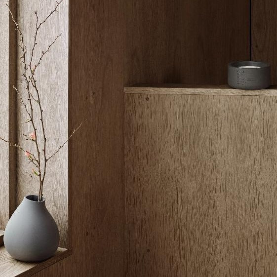 wood window sill with cherry blossoms displayed in a modern matte NONA vase