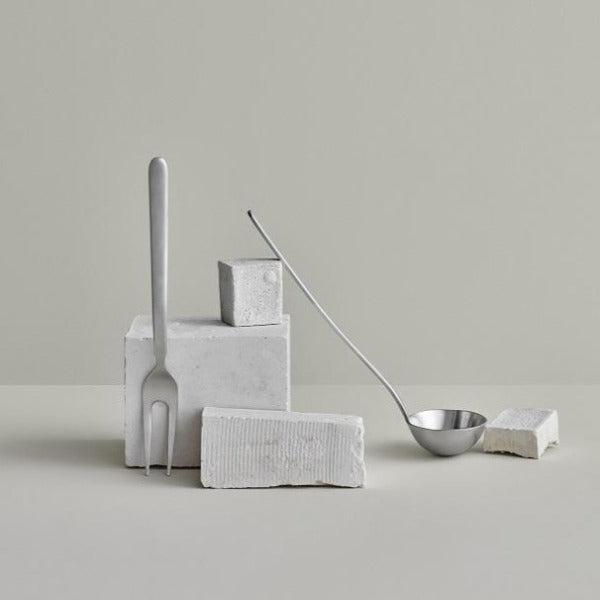 blomus STELLA elegant minimalist kitchen utensils arranged on a light grey background