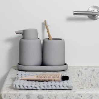 Simple bathroom setting with SONO minimalist bathroom accessories by blomus